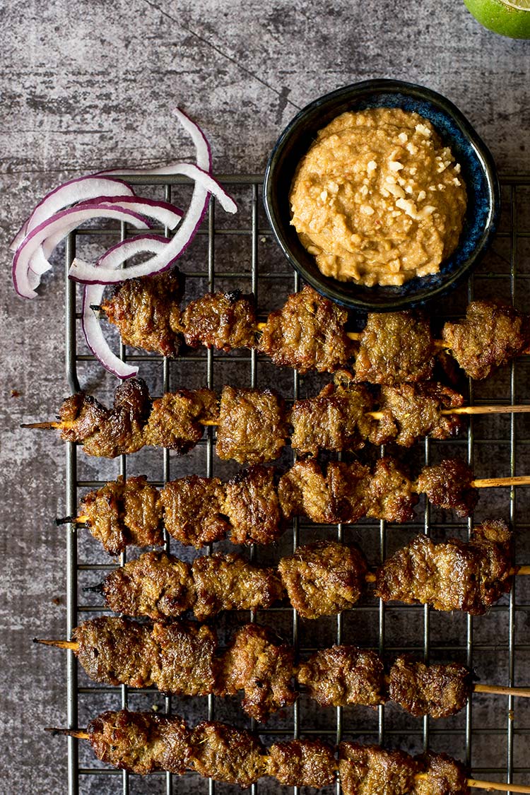 Flavorful, tender smoky beef satay marinated with plenty of herbs and spices dipped in a delectable savory, spicy, sweet peanut sauce.