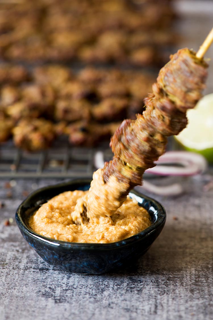 Flavorful, tender smoky beef satay marinated with plenty of herbs and spices dipped in a delectable savory, spicy, sweet peanut sauce.