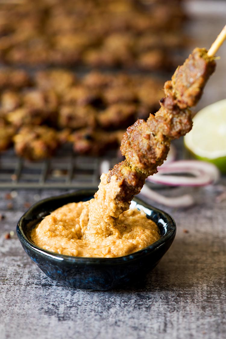 Flavorful, tender smoky beef satay marinated with plenty of herbs and spices dipped in a delectable savory, spicy, sweet peanut sauce.