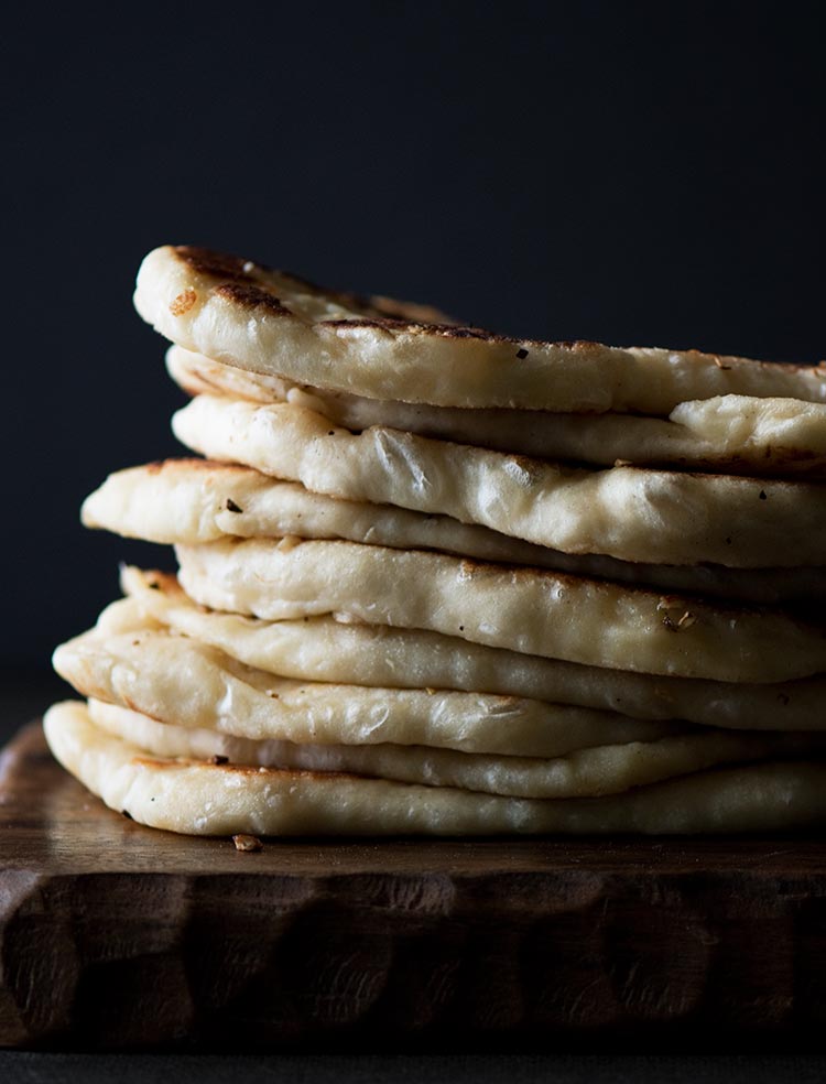 Amazing flavors of garlic & butter, beautifully charred & crisp outside yet insanely soft, chewy with melting cheese inside. Best part is, no kneading required.