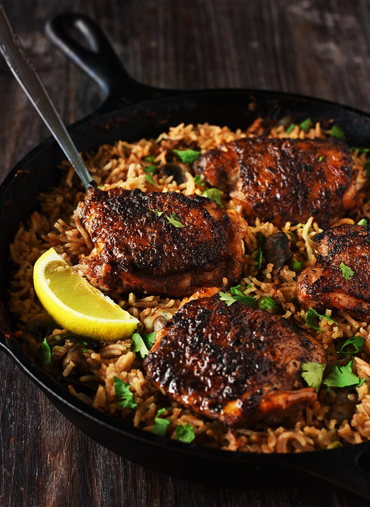 One Pan Spanish Rice & Chicken - Chicken marinated in a delicious rub is seared beautifully & rice infused with so much flavor, so delicious that you won't stop eating.
