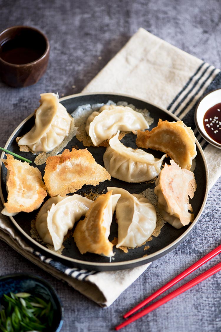 Part thin & crispy, part soft & tender with a delicious pork filling inside. The textural difference of the potstickers will blow your mind.