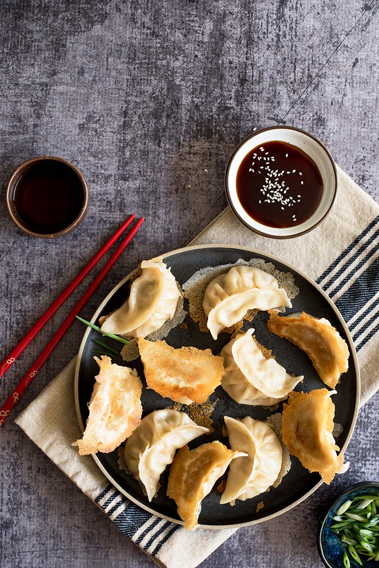 Part thin & crispy, part soft & tender with a delicious pork filling inside. The textural difference of the potstickers will blow your mind.