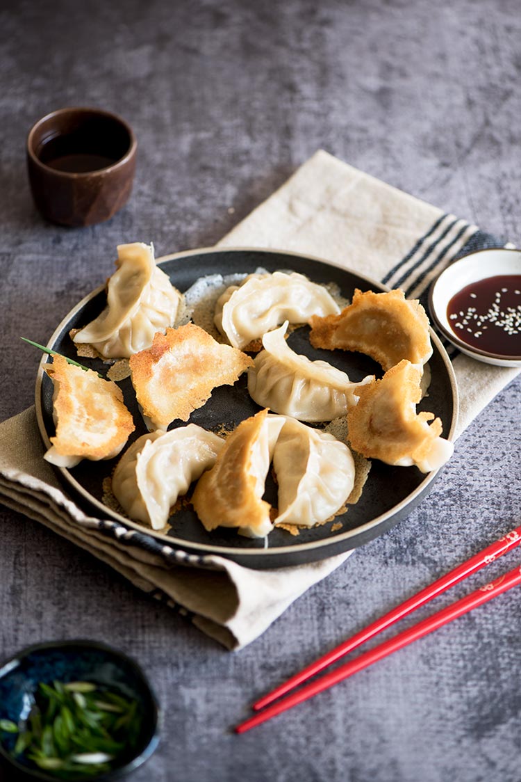 Part thin & crispy, part soft & tender with a delicious pork filling inside. The textural difference of the potstickers will blow your mind.