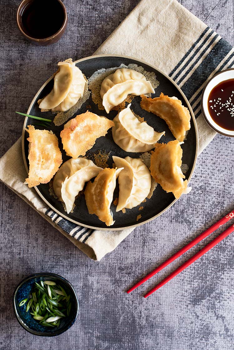 Part thin & crispy, part soft & tender with a delicious pork filling inside. The textural difference of the potstickers will blow your mind.