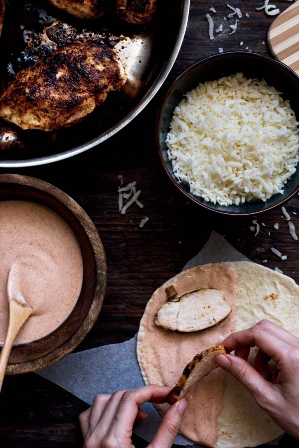 Chicken in Cajun spices seared to moist & tender perfection, a spicy & tangy sauce & ooeey gooey melting cheese. All in a warm tortilla.