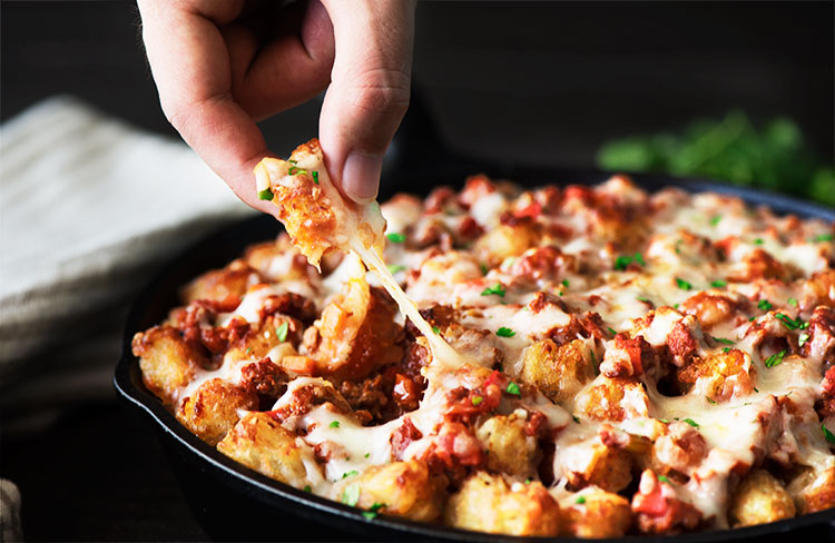 Buffalo Sloppy Joe Tater Tots - Crispy on the outside, soft and fluffy on the inside tater tots, sweet and spicy buffalo sloppy joes and ooey gooey melting cheese.