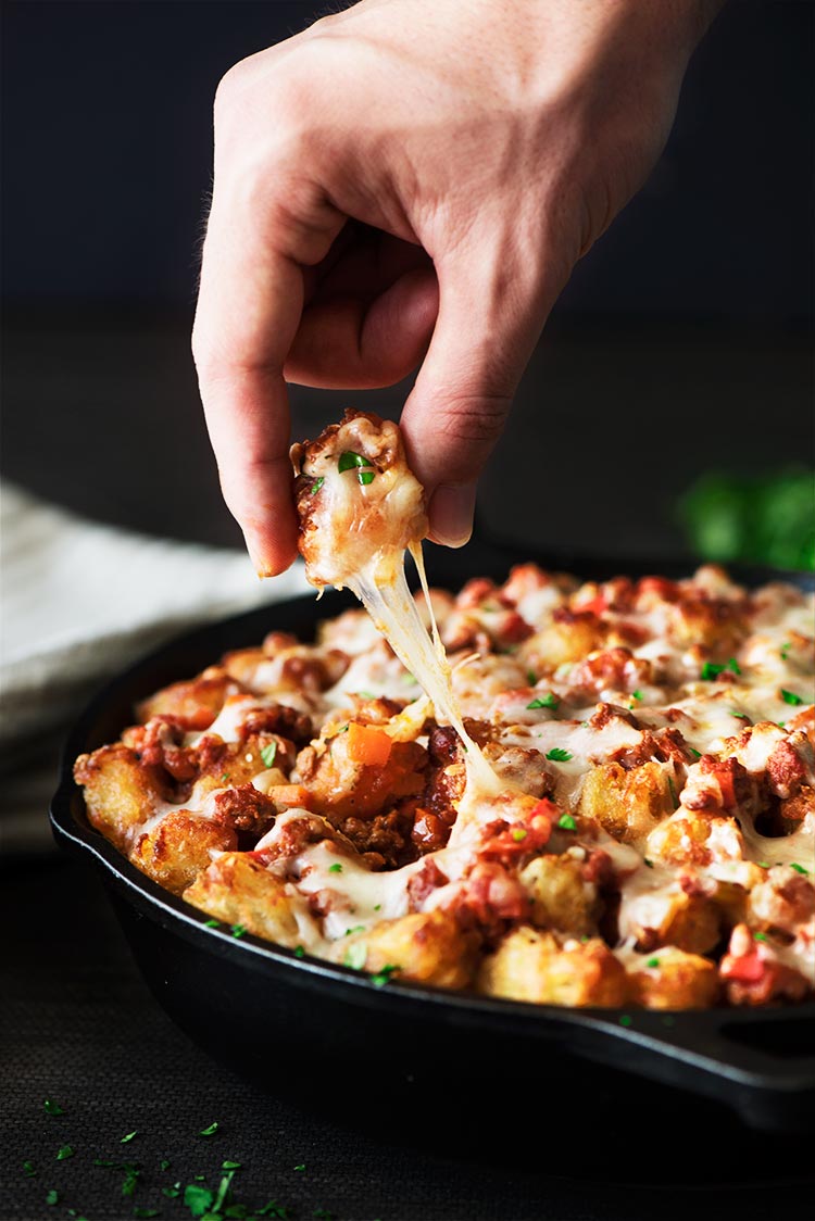 Buffalo Sloppy Joe Tater Tots - Crispy on the outside, soft and fluffy on the inside tater tots, sweet and spicy buffalo sloppy joes and ooey gooey melting cheese.