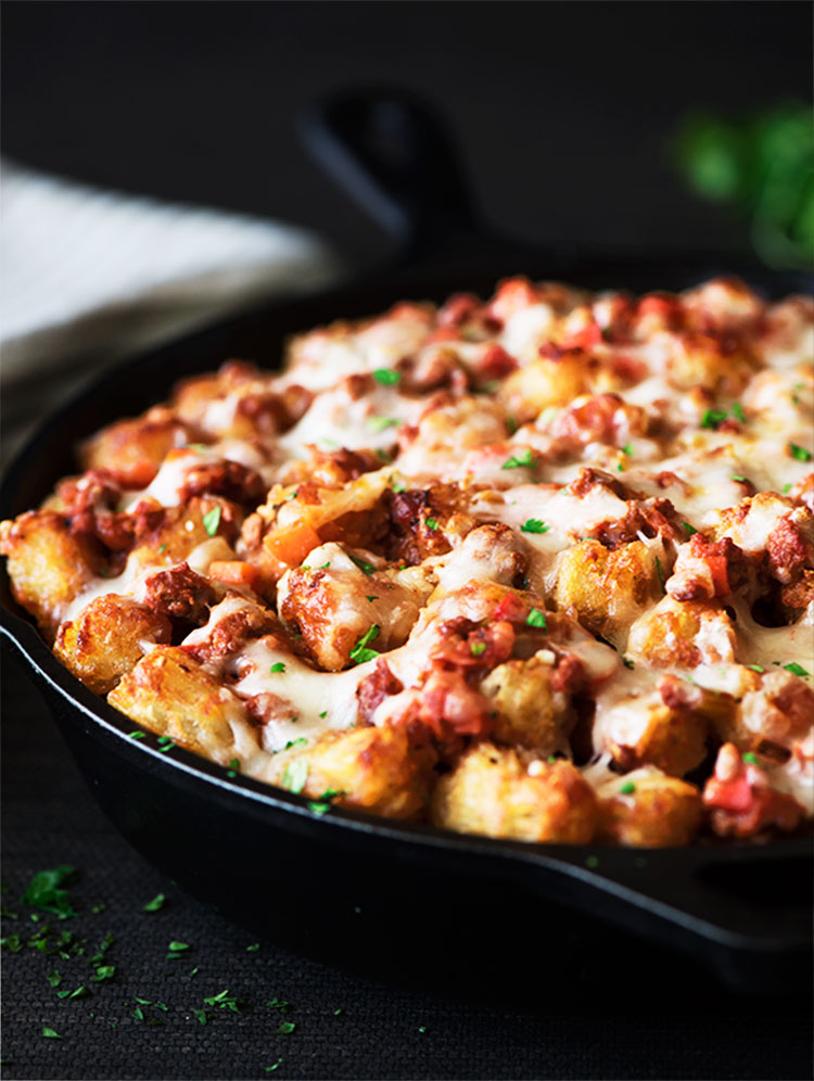 Buffalo Sloppy Joe Tater Tots - Crispy on the outside, soft and fluffy on the inside tater tots, sweet and spicy buffalo sloppy joes and ooey gooey melting cheese.