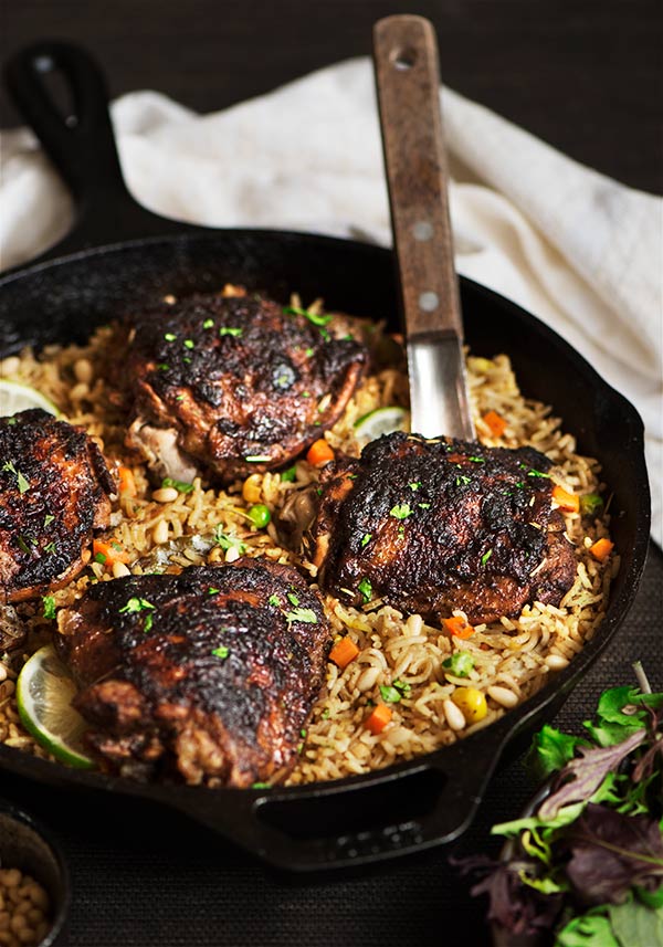 Tender & juicy chicken with spicy & slightly sweet flavor on an herbed Mediterranean rice cooked in chicken broth. So good. So addictive.