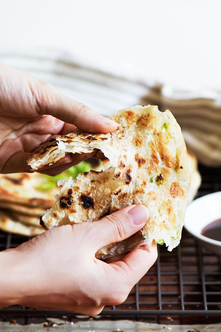 Extra crispy & flaky, lightly chewy Taiwanese Scallion Pancake. Savory pancakes fried to perfection with just 5 ingredients to make at home.