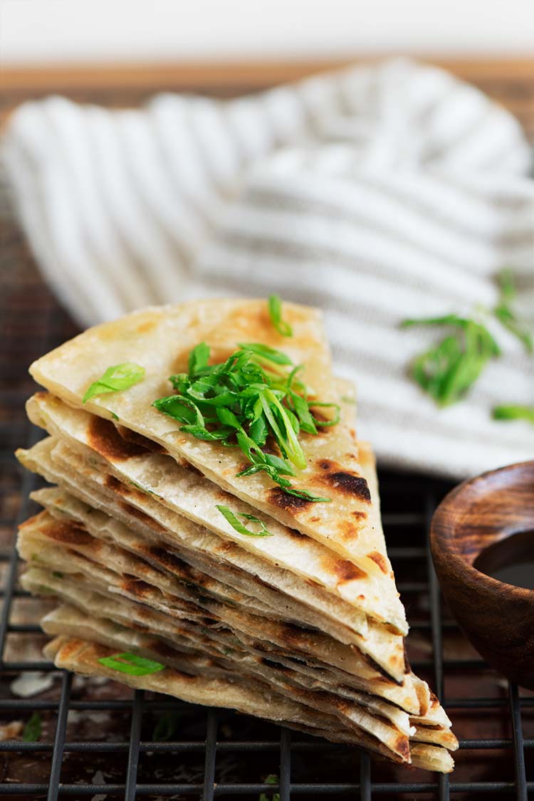 Extra crispy & flaky, lightly chewy Taiwanese Scallion Pancake. Savory pancakes fried to perfection with just 5 ingredients to make at home.