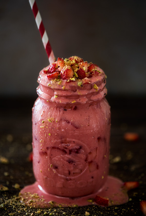 Thick and creamy strawberry yogurt drink made from real fruit and topped with crushed pistachios and chopped fresh strawberries.