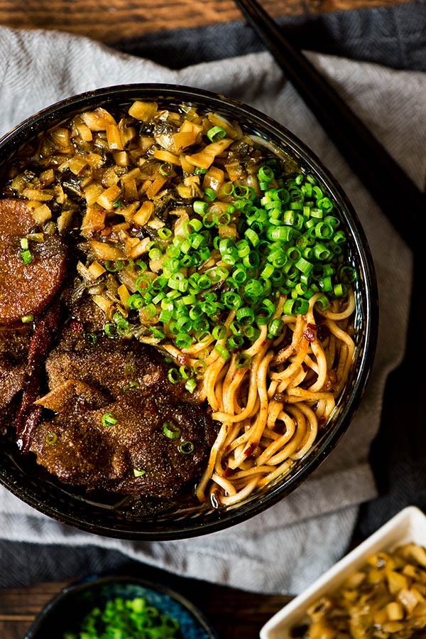 Flavor packed beef noodle soup made from beef stock of 3 types of meat plus a concentrated beef sauce. Top with melt in the mouth beef, noodles & pickled mustard green.