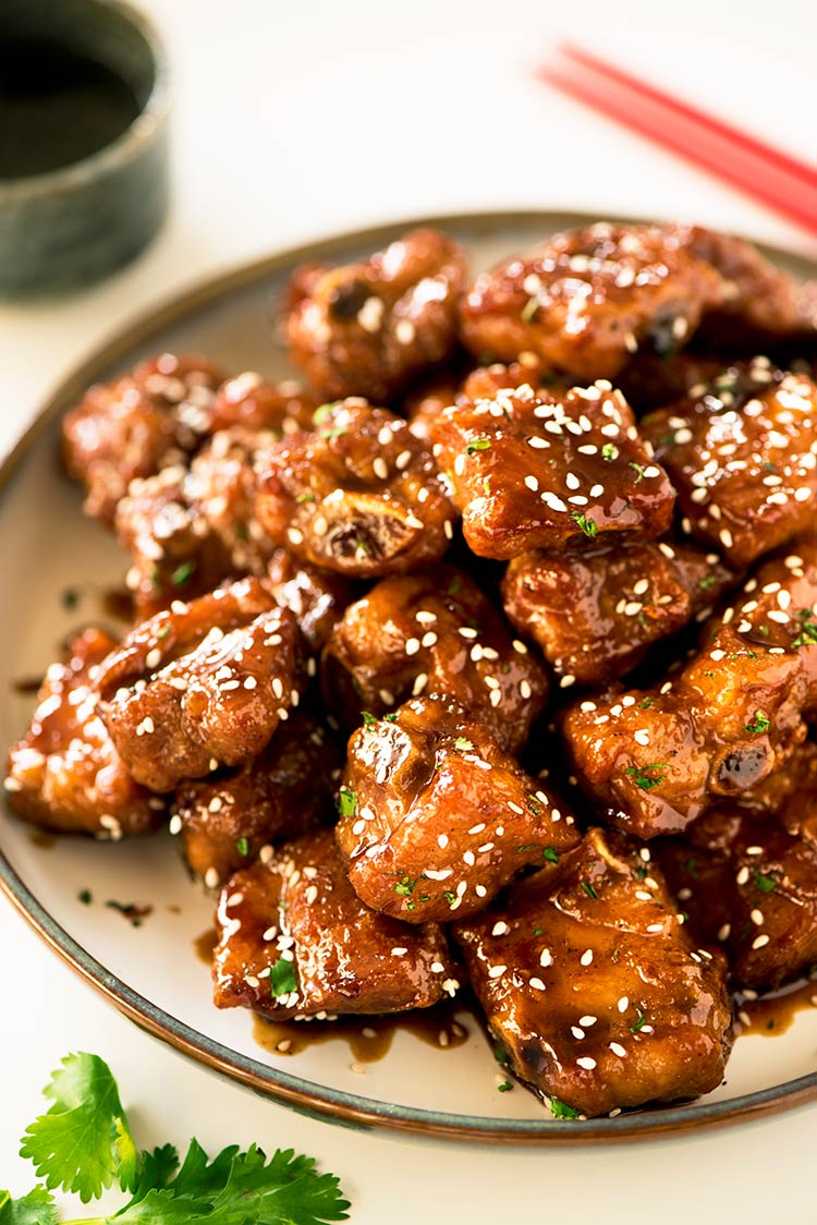 Gorgeous crispy baby back ribs coated in a thick sticky, sweet and savory glaze.