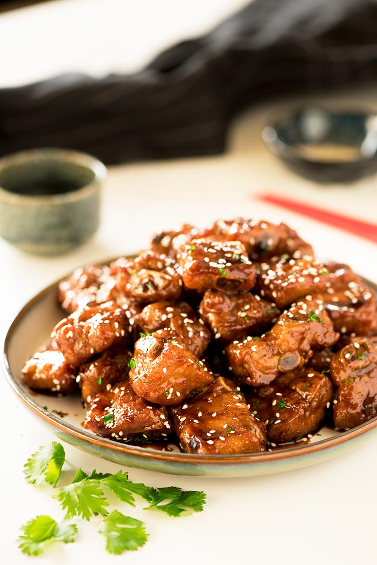 Gorgeous crispy baby back ribs coated in a thick sticky, sweet and savory glaze.