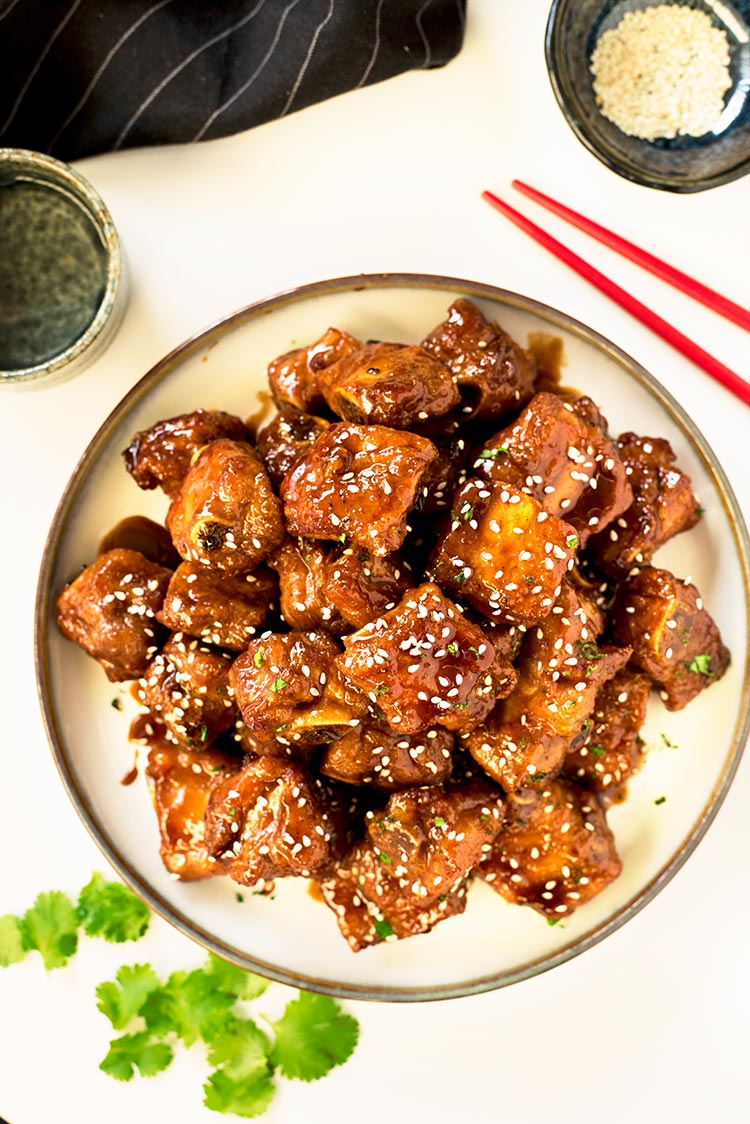 Gorgeous crispy baby back ribs coated in a thick sticky, sweet and savory glaze.