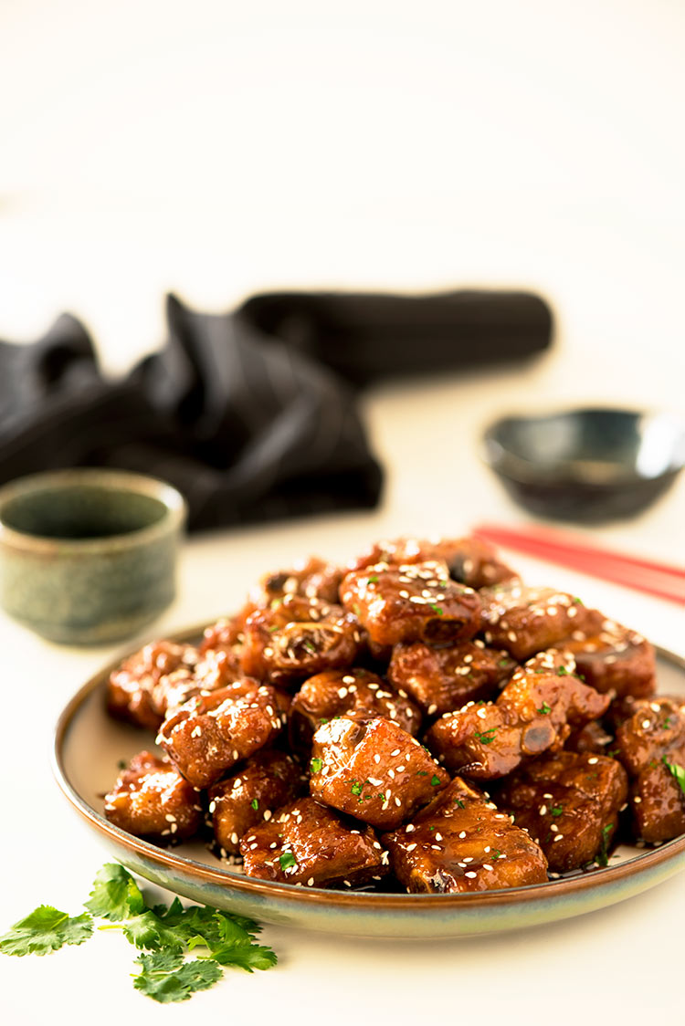 Gorgeous crispy baby back ribs coated in a thick sticky, sweet and savory glaze.