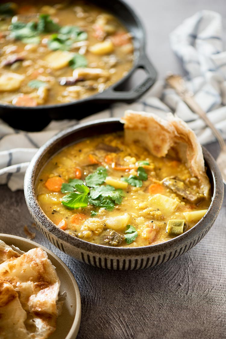 Flavor packed hearty & healthy South Indian lentil based curry stew filled with vegetables. It's mildly spicy and a tad sour from the tamarind & tomatoes. 