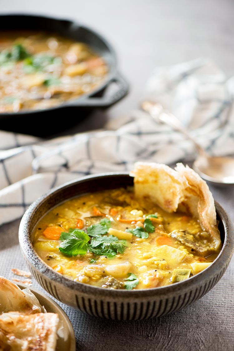 Flavor packed hearty & healthy South Indian lentil based curry stew filled with vegetables. It's mildly spicy and a tad sour from the tamarind & tomatoes. 