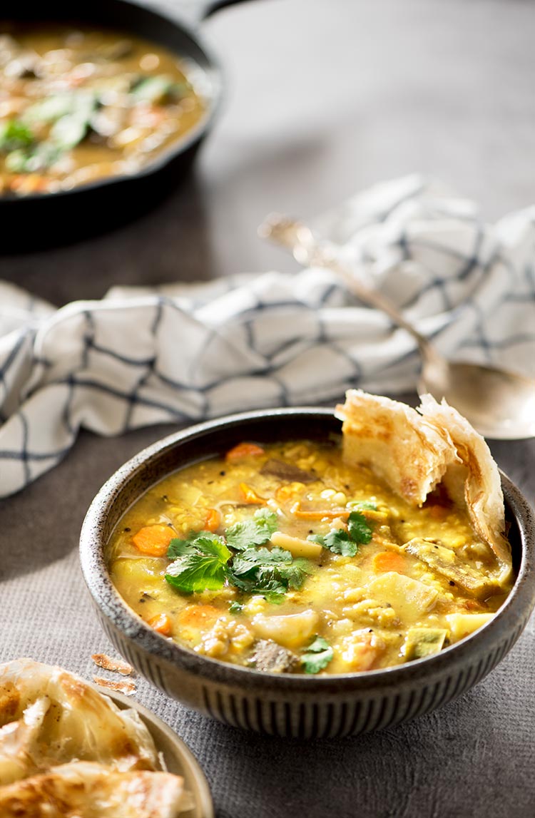 Flavor packed hearty & healthy South Indian lentil based curry stew filled with vegetables. It's mildly spicy and a tad sour from the tamarind & tomatoes. 