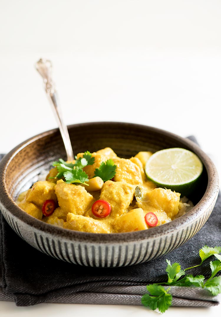 Savory and slightly tangy creamy curry with the softest & juiciest chicken ever and delicious tender potatoes.