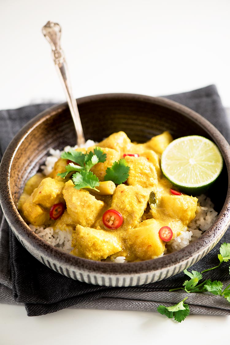 Savory and slightly tangy creamy curry with the softest & juiciest chicken ever and delicious tender potatoes.