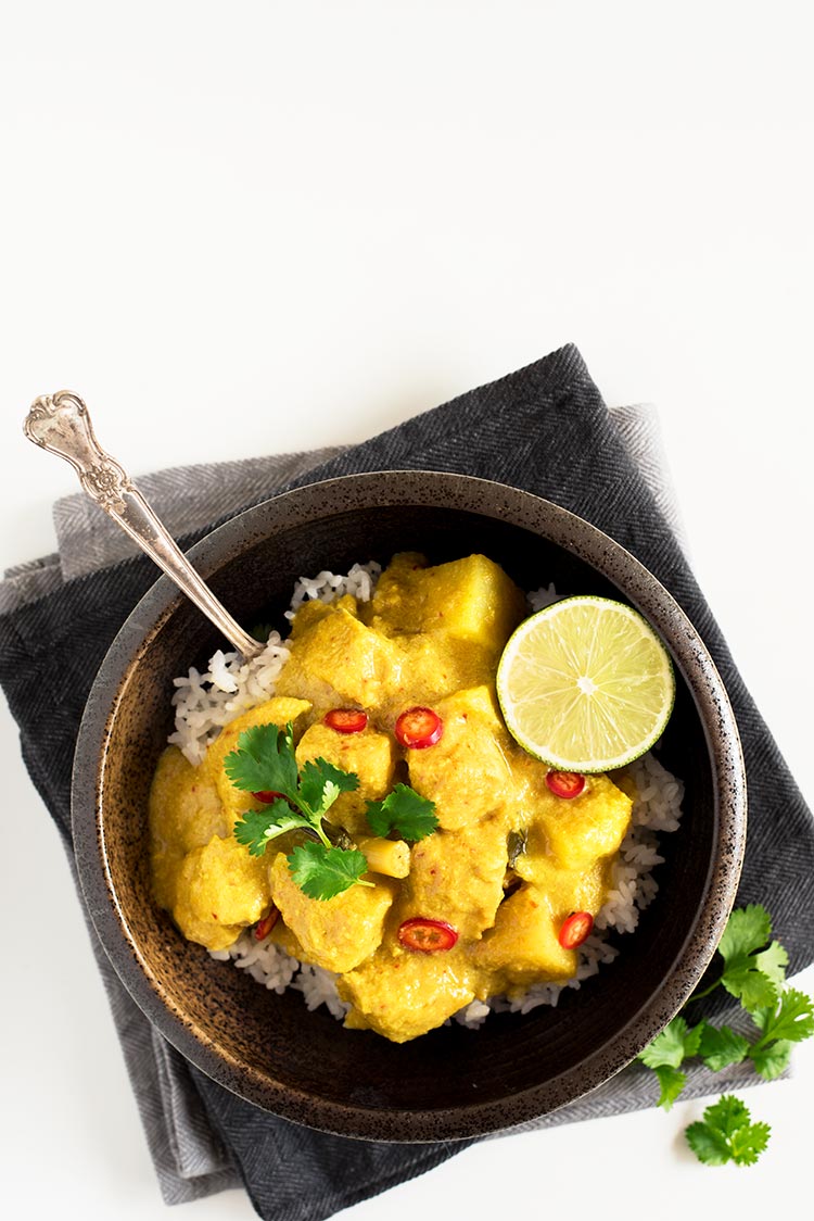 Savory and slightly tangy creamy curry with the softest & juiciest chicken ever and delicious tender potatoes.