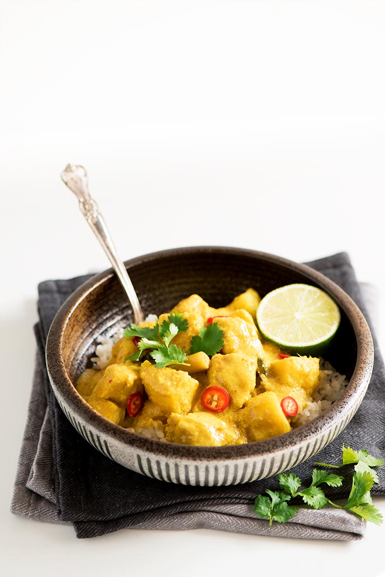 Savory and slightly tangy creamy curry with the softest & juiciest chicken ever and delicious tender potatoes.