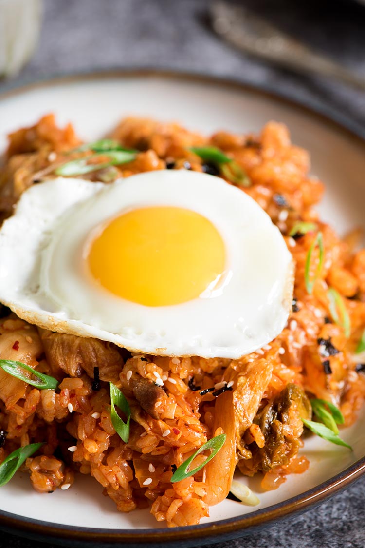 Spicy kimchi pork belly fried rice with sunny side eggs cooked in under 10 minutes.