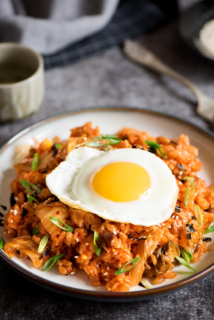 Spicy kimchi pork belly fried rice with sunny side eggs cooked in under 10 minutes.