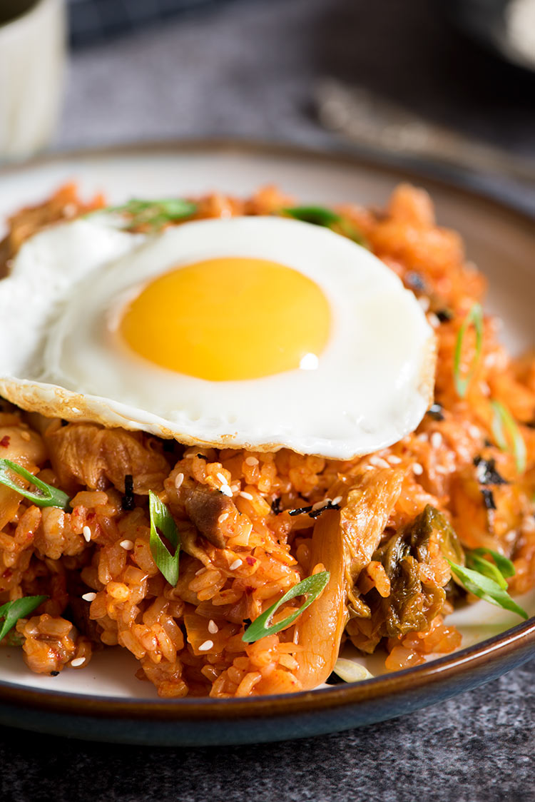 Spicy kimchi pork belly fried rice with sunny side eggs cooked in under 10 minutes.