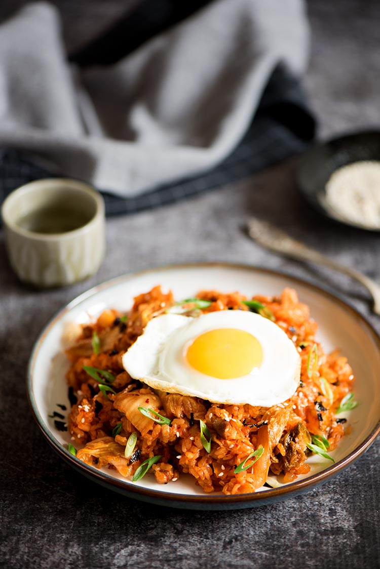 Spicy kimchi pork belly fried rice with sunny side eggs cooked in under 10 minutes.